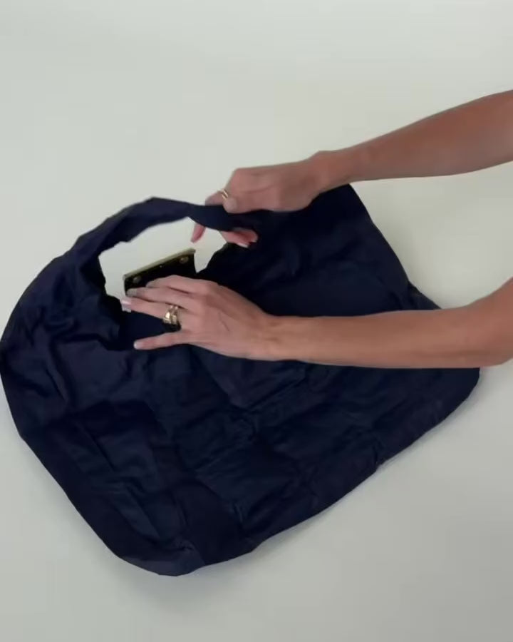 Llavero convertible en bolso de mano